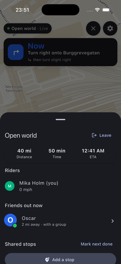 Navigating a route, with the next turn and the group's position on screen.